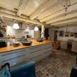Fully functional kitchen in the detached house, featuring traditional details and modern appliances