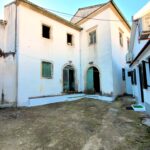 Front view of the 211 sq.m. two-story stone mansion with new roof and ring beam, ready for renovation