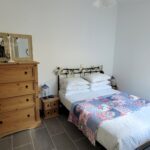 Bedroom of the apartment with ensuite bathroom and walk-in closet, designed for comfort and functionality