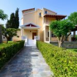 Beautiful landscaped garden with lawn and mature trees in Corfu countryside villa