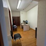 Spacious hallway in commercial space with apartment conversion potential