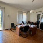 Natural light filling second-floor commercial space with three balconies
