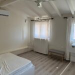 Spacious and bright bedroom in a fully renovated house in Alepou, Corfu, with stylish decor.