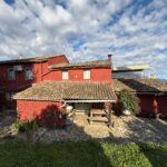 Exterior view of the house with lush greenery surrounding the property in Kato Korakiana