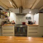 Fully functional kitchen in the detached house, featuring traditional details and modern appliances