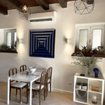 Spacious living area with traditional charm and modern amenities in the Gastouri house