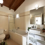 Modern bathroom with contemporary fixtures and finishes on the upper floor of the house in Gastouri