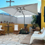 Private yard with a small outdoor seating area, perfect for relaxation in Gastouri, Corfu