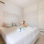 Well-appointed bedroom with modern furnishings and natural light.