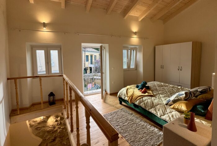 First floor bedroom with access to a balcony