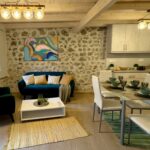 Cozy living room with stone walls and rustic décor