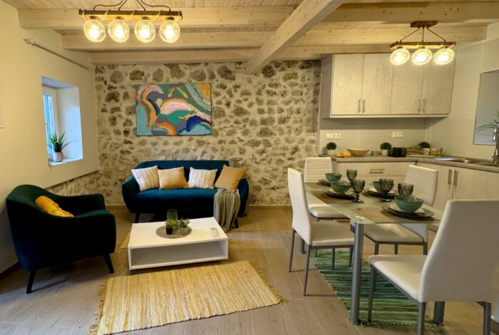Cozy living room with stone walls and rustic décor