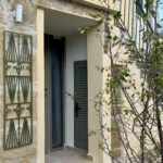 Entrance of the semi detached house in the traditiona village of Sinarades