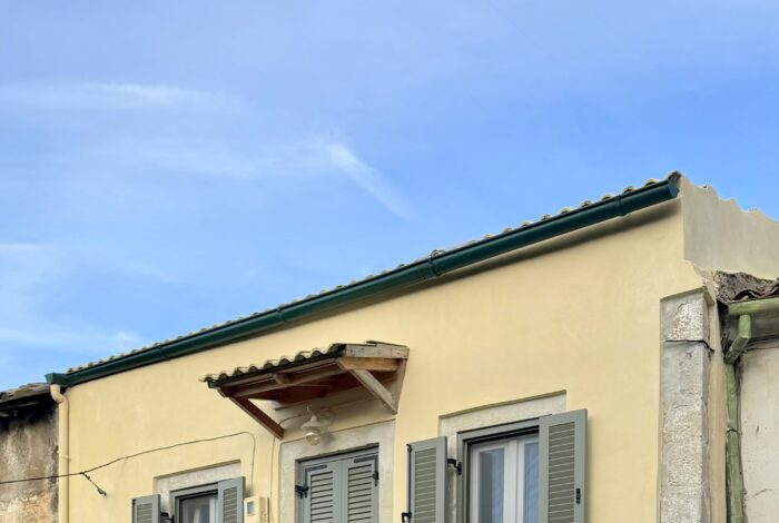 Traditional Corfiot house facade with stone details