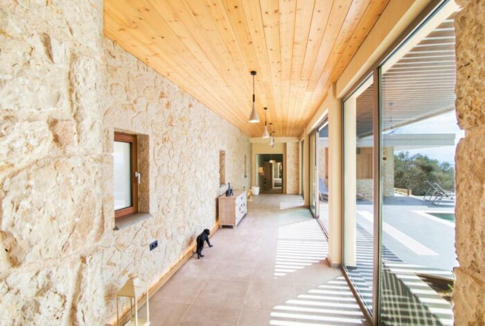 Large sliding doors connecting the living room to the outdoor terrace