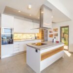 Elegant kitchen with modern appliances in luxury stone villa in Nissaki