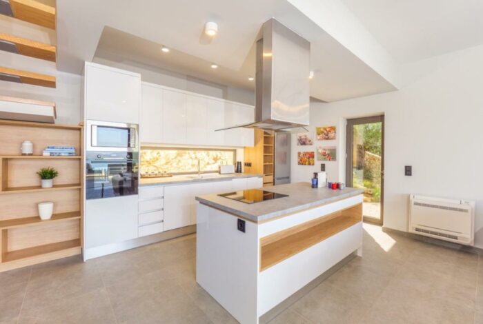 Elegant kitchen with modern appliances in luxury stone villa in Nissaki