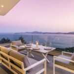 Sunrise over the sea from private villa pool terrace in Corfu