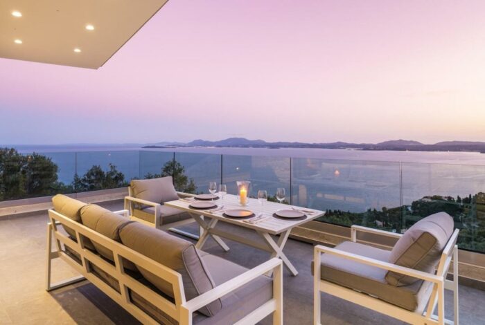 Sunrise over the sea from private villa pool terrace in Corfu