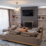 Cozy lounge area with fireplace for relaxed living in Corfu