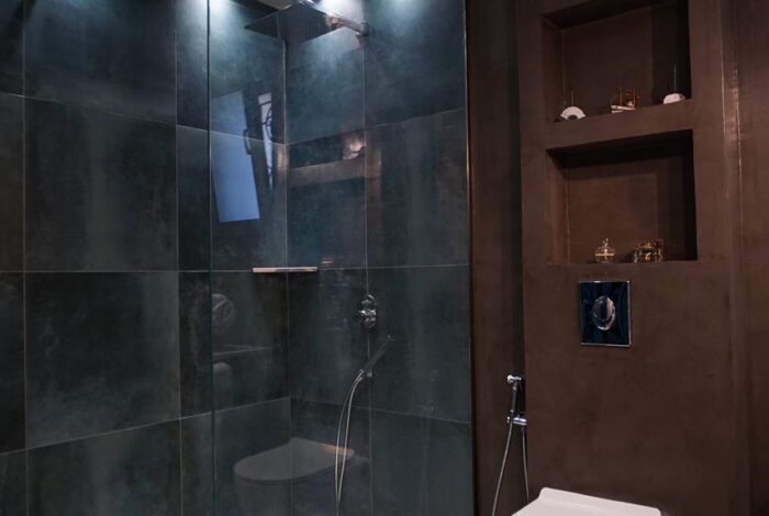Modern bathroom with walk-in shower in Corfu villa