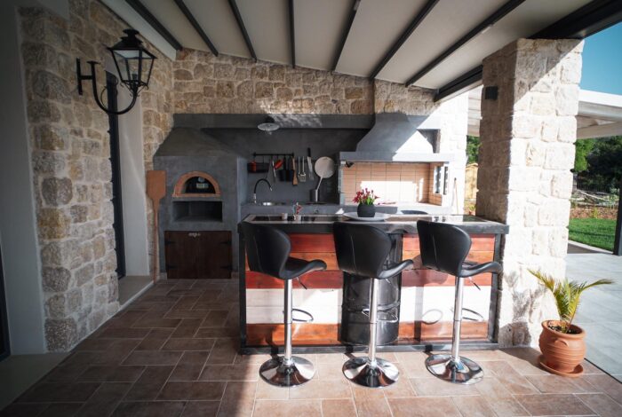 Cozy outdoor sitting area next to the private pool for relaxation in Corfu villa