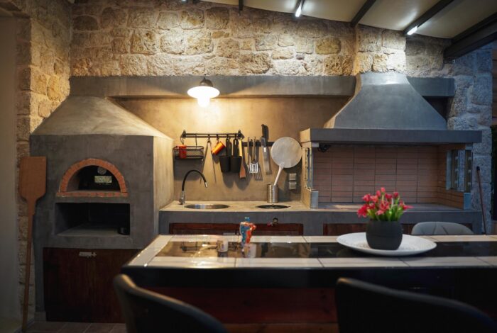 Stylish outdoor BBQ area with dining space, perfect for al fresco meals in Corfu villa