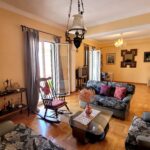 Open-plan dining and lounge area with natural light and views of the Old Fortress