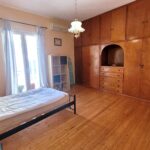 Comfortable and airy second bedroom in central Corfu apartment for sale