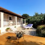 Villa for sale in North West Corfu with spacious outdoor patio and Mediterranean setting