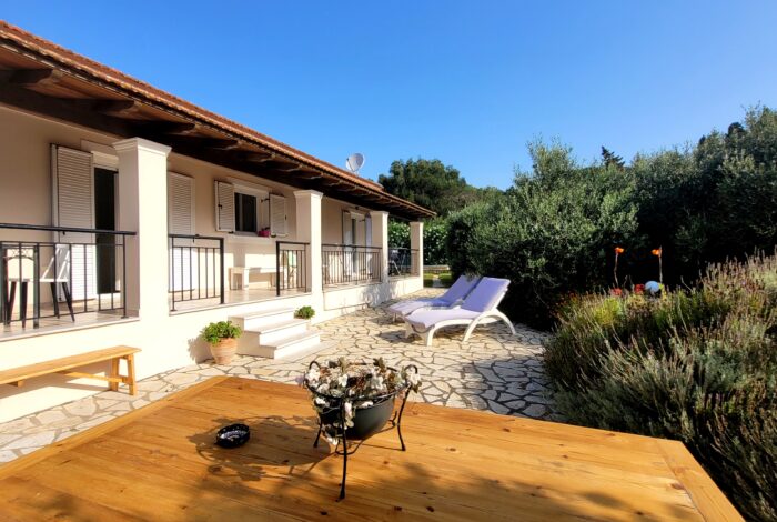 Villa for sale in North West Corfu with spacious outdoor patio and Mediterranean setting