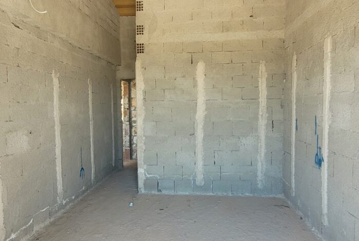 Bare bedroom interior awaiting final touches in Corfu stone villa
