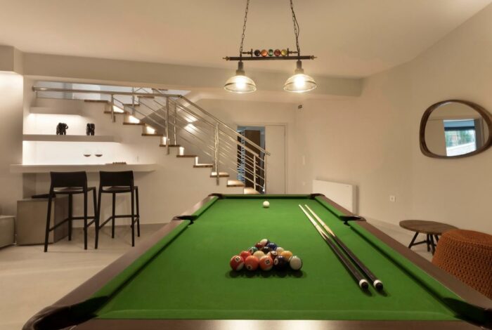 Cozy games/TV room with comfortable seating and stylish decor in Kassiopi villa