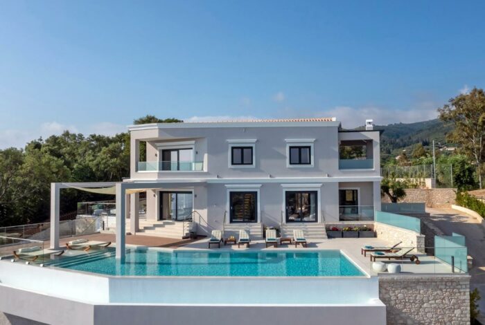Aerial view of the modern villa and the infinity pool