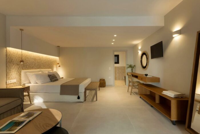 Spacious bedroom in Kassiopi villa with neutral decor and natural light