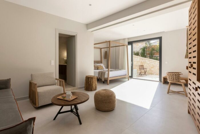 Guest bedroom with private entrance, modern furnishings, and garden views