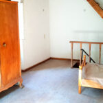 First-floor bedroom with natural light in traditional Corfu house for sale