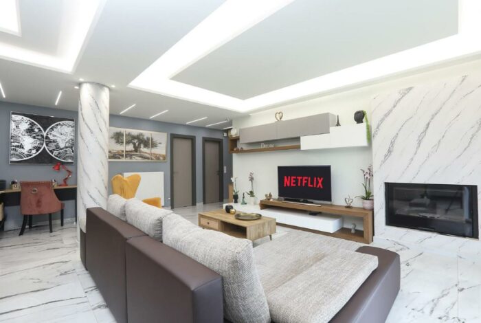 Spacious open-plan living room with energy fireplace