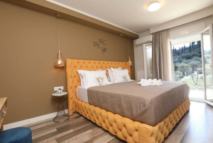 Bright bedroom with balcony access and garden views