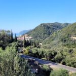 Inclined plot of land with distant sea view in Agios Gordios, Corfu
