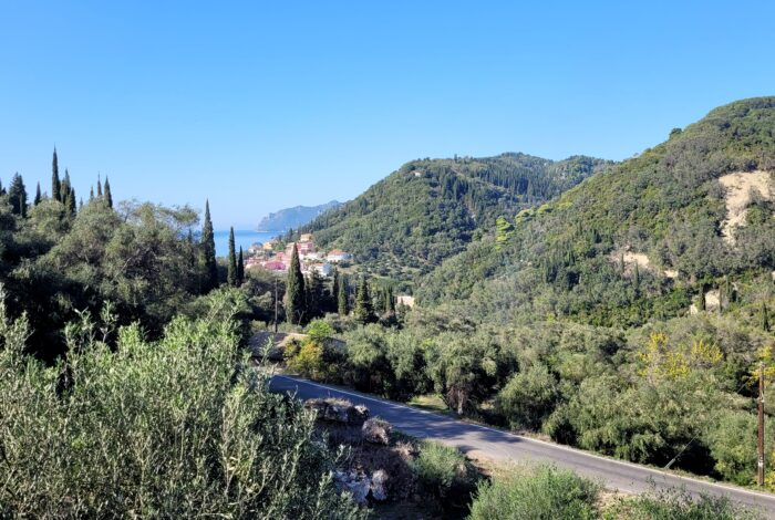 Inclined plot of land with distant sea view in Agios Gordios, Corfu