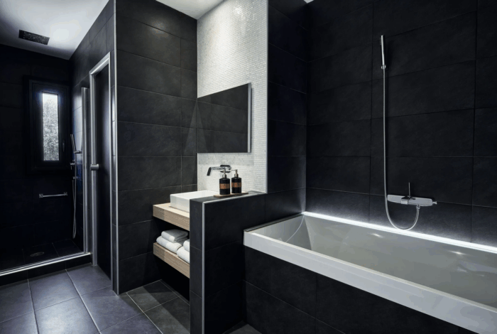 Modern bathroom with sleek fixtures and large mirror in Corfu villa for sale