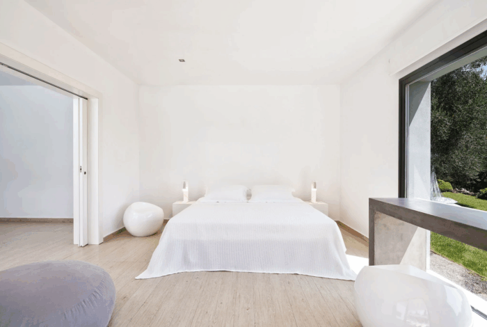 Master bedroom with sea view and private balcony in Viros modern villa