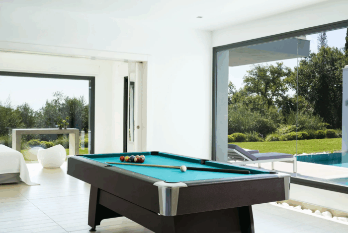 Stylish billiard room in high-end Corfu villa with minimalist interior design