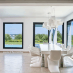 Spacious dining area with natural light and pool views in Corfu luxury home