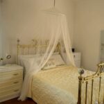 Cozy guest bedroom on the ground floor with natural light and garden views