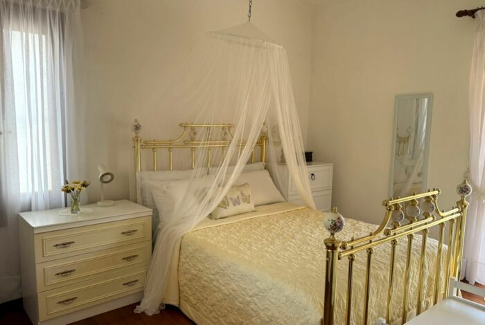 Cozy guest bedroom on the ground floor with natural light and garden views