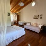 Master bedroom with en-suite bathroom and access to private balcony in Linia