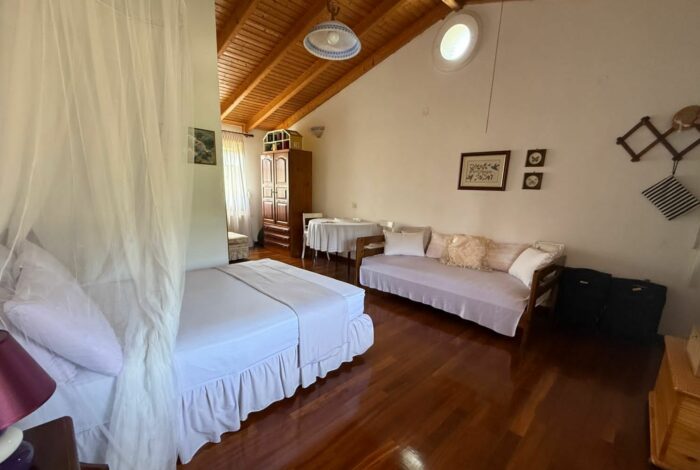 Master bedroom with en-suite bathroom and access to private balcony in Linia