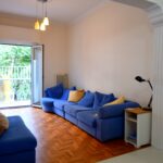 Renovated living room with modern flooring and natural light – Kypseli apartment for sale